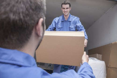 Removal team planning a local move in Brent with boxes and furniture