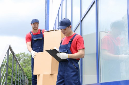 Furniture removals team handling bulky household items in Brent