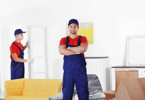 Man with van service loading furniture into a vehicle