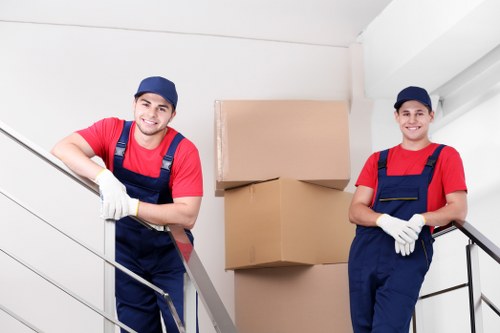 Loading commercial furniture into a moving vehicle in Brent