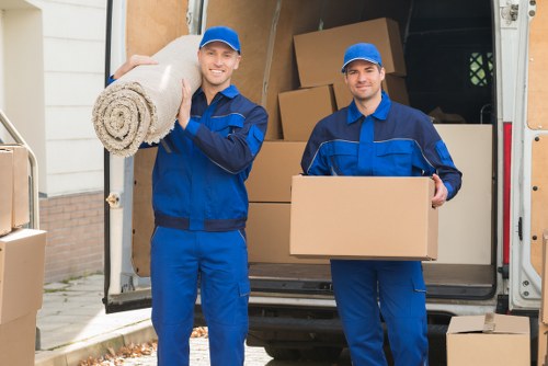 Removal team planning a move in a Brent residential street