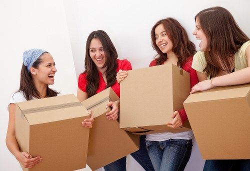 Office relocation with labelled boxes and workplace items
