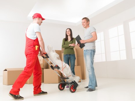 Trained moving staff handling boxes with care