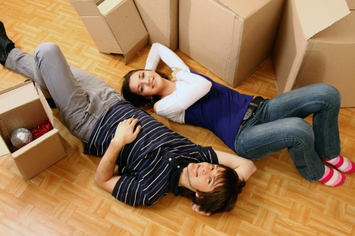 Unpacking boxes in a Brent property after moving day